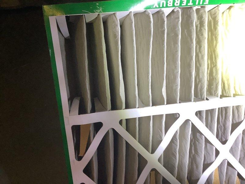 Performed scheduled HVAC system maintenance and inspection within specified time window. Assessed homeowner's concern regarding outdoor condensing unit installation and determined existing pad configuration was adequate for unit size and airflow requirements—no box platform necessary. Inspected heat exchanger and evaporator coil assembly, noting normal operational wear with minor dust accumulation around coil edges. Installed new pleated air filters to maintain proper system airflow and indoor air quality. System operational and performing within normal parameters upon completion.