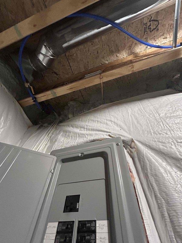 Completed electrical assessment for Level 2 EV charging station installation at residential property. Evaluated existing electrical infrastructure including main service panel location in basement area and exterior meter placement on building's side wall. Documented current electrical capacity, panel accessibility, and optimal conduit routing path from main panel to proposed charging station location to ensure safe and code-compliant installation.
