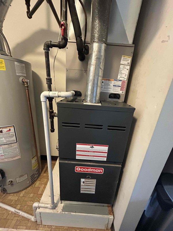 Responded to no heat call and diagnosed non-functional Emerson programmable thermostat. Upon inspection, found thermostat display blank and unresponsive to input commands. Verified Goodman furnace unit operational and determined thermostat failure as root cause of heating system malfunction.