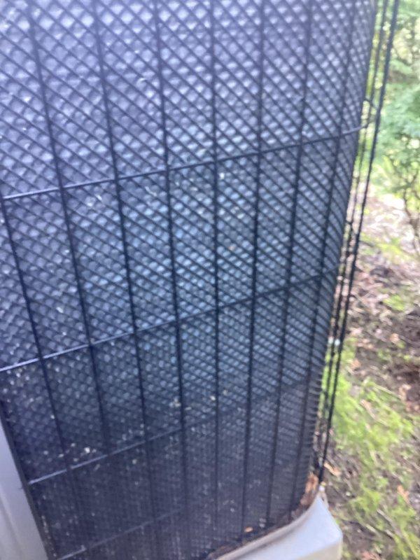 Completed annual preventive maintenance on residential cooling system. Inspected outdoor condenser unit, verified operational status of all components, and documented equipment condition. Unit showed normal weathering with surface debris accumulation on protective grille panels, consistent with outdoor exposure.