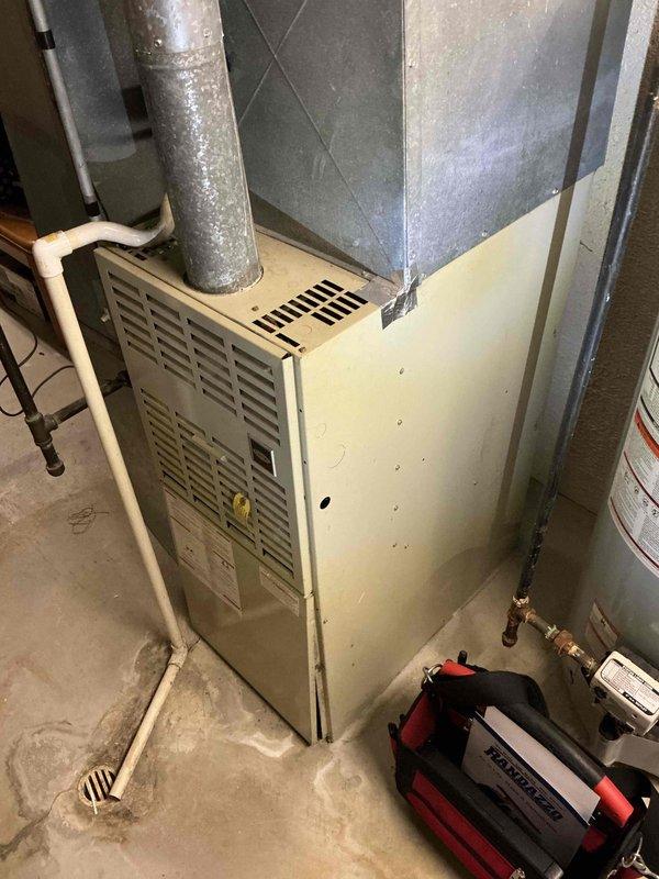 Provided estimate for replacement of 33-year-old natural gas furnace located in basement that is experiencing intermittent operation and has been deemed unsafe to operate. Assessed existing HVAC system including ductwork configuration, venting requirements, and utility connections to determine proper replacement specifications for new high-efficiency furnace installation.