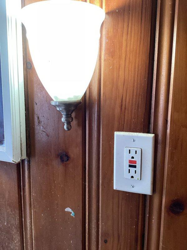 Responded to service call for non-operational exterior floodlight and bedroom light switch. Diagnosed electrical issues in attic bedroom with sloped ceiling and exterior lighting circuit. Troubleshot and repaired faulty light switch controlling bedroom ceiling fixture and restored functionality to outdoor floodlight. Verified proper operation of GFCI outlet in adjacent area and confirmed all circuits were functioning safely upon completion.
