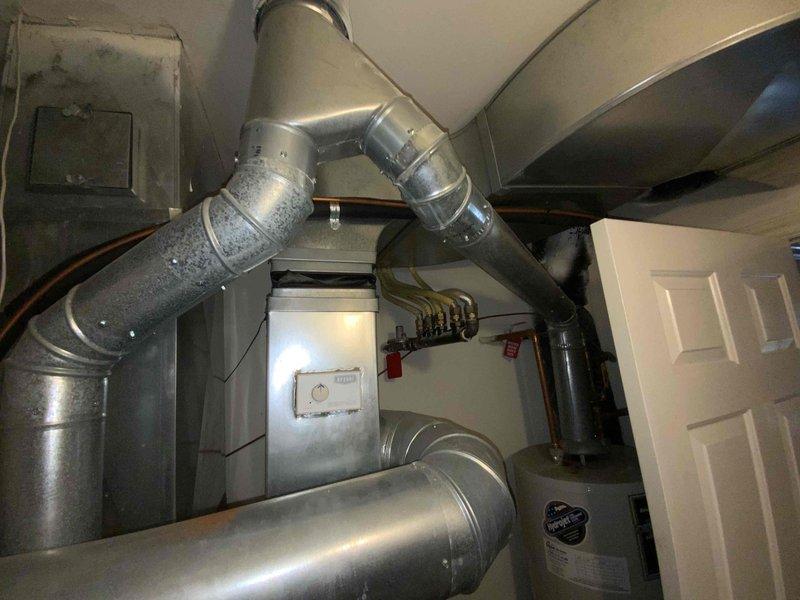 Conducted comprehensive full system evaluation of 21-year-old Bryant HVAC system located in basement utility room. Assessed existing gas furnace, ductwork configuration, and overall mechanical installation to provide complete system replacement estimate for customer requesting immediate replacement timeline.