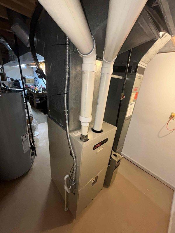 Responded to no heat call on 28-year-old gas forced air furnace that was completely out of service. Performed comprehensive system evaluation and provided full system replacement estimate for aging equipment that had reached end of service life. Documented existing installation including furnace, ductwork configuration, and mechanical room layout with photographic evidence for quote preparation.