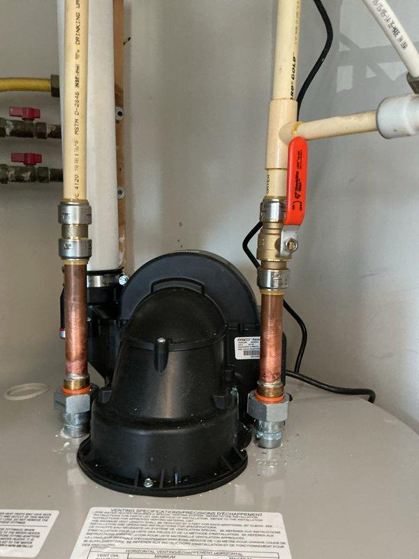 Installed a 50-gallon Bradford White power vent water heater in residential utility closet. Completed all necessary plumbing connections using copper and PEX piping with appropriate fittings and shut-off valves. Secured circulation pump with proper electrical connections and verified all mechanical connections for proper operation per manufacturer specifications.