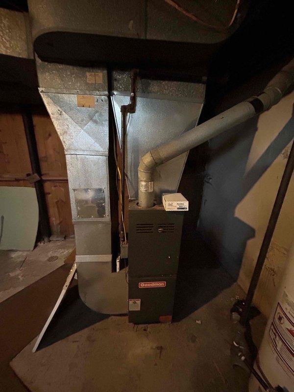 Responded to service call for Goodman furnace not heating in basement location. Upon inspection, identified control board and relay system issues preventing proper furnace operation. Evaluated electrical connections, circuit board condition, and control modules to diagnose heating failure. Documented existing equipment configuration including ductwork, ventilation system, and electrical components for new homeowner's records.