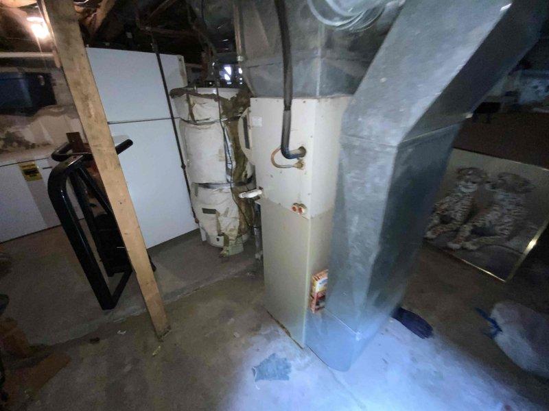 Provided estimate for replacement of non-functional 20-year-old furnace and air conditioning system located in basement. Assessed existing HVAC equipment, ductwork configuration, and utility space layout to determine proper sizing and installation requirements for new system under furnace and air conditioning replacement promotion.