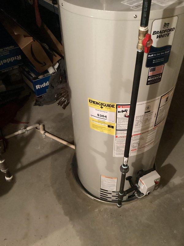Completed installation of 50-gallon power vent Bradford White water heater in residential basement location. Removed existing unit and installed new tank with CPVC piping, fittings, drain pan, and proper venting per manufacturer specifications and local code requirements. All connections tested and verified operational, with required permits obtained prior to installation.