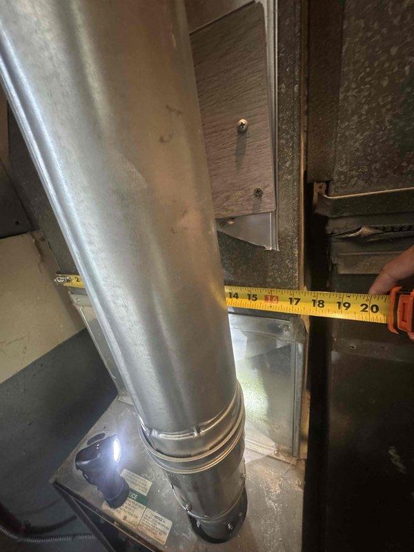 Conducted on-site evaluation for cooling system installation at residential property equipped with existing central heating but no air conditioning. Assessed existing 15-year-old HVAC infrastructure including ductwork dimensions and clearances in mechanical room to determine feasibility of adding central air conditioning versus ductless mini-split system installation. Documented current system configuration and exterior mounting locations to provide comprehensive cooling solution recommendations for newly purchased home requiring immediate temperature control capabilities.