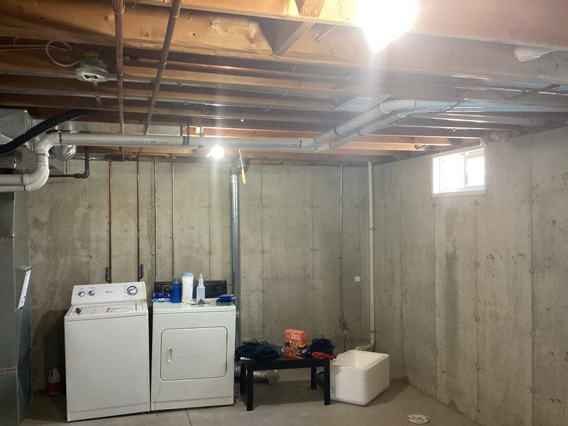 Completed full HVAC system installation in basement utility area, installing a new 70,000 BTU gas furnace and 2-ton air conditioning unit with rear discharge configuration. Reconnected all existing ductwork, plumbing, and electrical connections to new equipment, ensuring proper integration with home's mechanical systems. Obtained necessary mechanical and electrical permits, processed Michigan Saves financing documentation, and submitted utility rebate applications to DTE and SEMCO Energy for customer incentives.