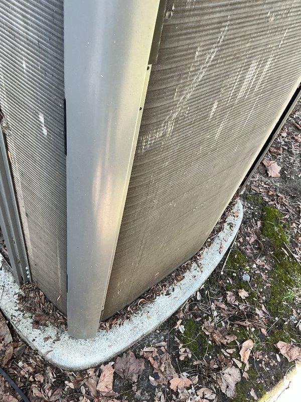 Completed annual cooling maintenance on residential split system. Replaced dirty air filter showing moderate dust accumulation and installed new evaporative cooler pad. Inspected exterior unit at building foundation, verified proper operation of all components, and documented system condition with photos.