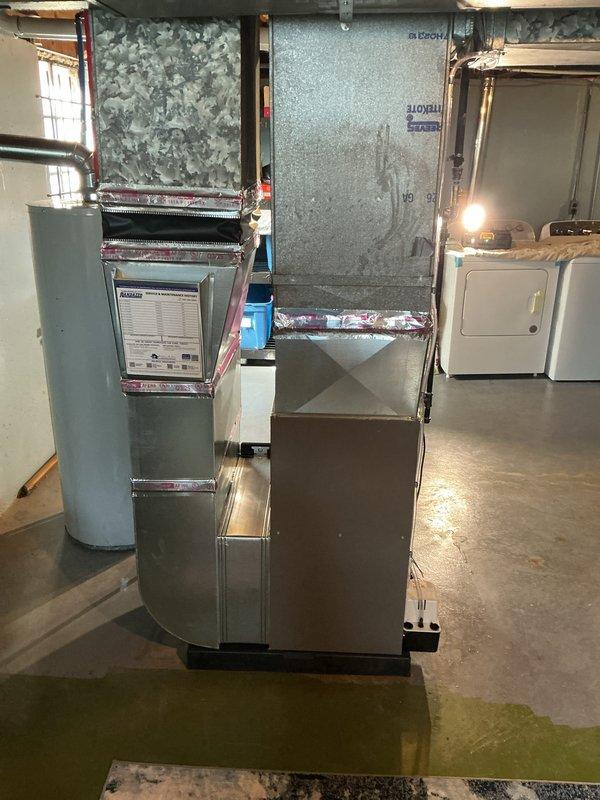 Completed furnace-only installation of 70,000 BTU unit in basement mechanical room. Obtained mechanical and electrical permits prior to installation, installed new furnace with proper venting and flue liner, connected to existing ductwork plenum, and reconnected all electrical components per code requirements.