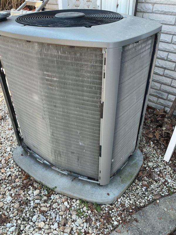 Completed routine air conditioning maintenance on outdoor condenser unit. Performed standard ACM inspection, removed and cleaned top grille assembly with hardware stored in collection pan during service, verified unit operational status, and reassembled equipment. Unit operating within normal parameters upon completion of maintenance procedures.