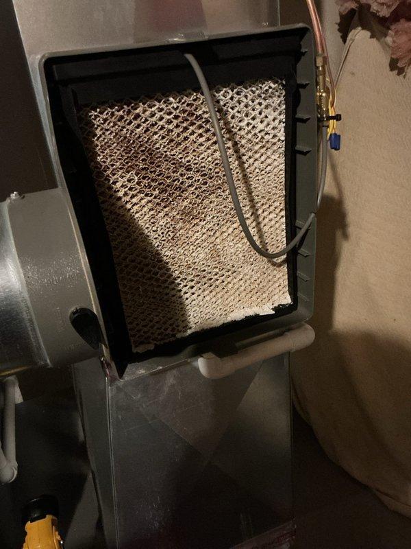 Completed annual heating and cooling maintenance on residential HVAC system. Inspected evaporator coil through access panel and confirmed proper condition with no visible damage or deterioration to honeycomb mesh structure. Performed electrical diagnostics using digital multimeter to verify system operation and measured voltage readings across control circuit connections. Verified refrigerant line connections and service valve accessibility. All components found to be functioning within normal parameters.