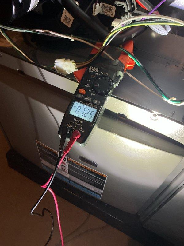 Completed annual heating and cooling maintenance on residential HVAC system. Inspected evaporator coil through access panel and confirmed proper condition with no visible damage or deterioration to honeycomb mesh structure. Performed electrical diagnostics using digital multimeter to verify system operation and measured voltage readings across control circuit connections. Verified refrigerant line connections and service valve accessibility. All components found to be functioning within normal parameters.