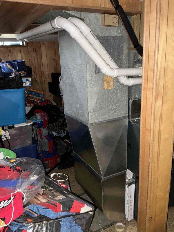 Performed full system estimate for residential HVAC replacement after diagnosing failed blower motor in existing furnace unit located in basement. Evaluated both indoor furnace with plenum and condensate drainage system, as well as outdoor condenser unit showing signs of age and weathering. Provided comprehensive replacement quote for complete heating and cooling system to address immediate equipment failure and customer's preference for full system upgrade rather than component-level repair.