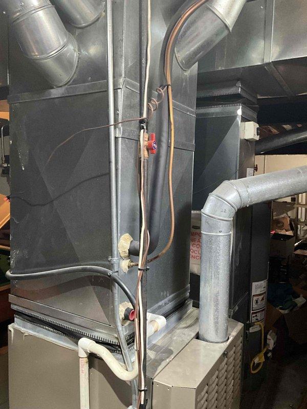 Conducted on-site evaluation for complete HVAC system replacement of 22-year-old furnace and air conditioning unit. Assessed existing equipment configuration including ductwork, refrigerant lines, condensate drainage system, and electrical connections in basement mechanical room. Provided comprehensive replacement quote for new heating and cooling system to customer who is comparing multiple estimates before proceeding with installation.