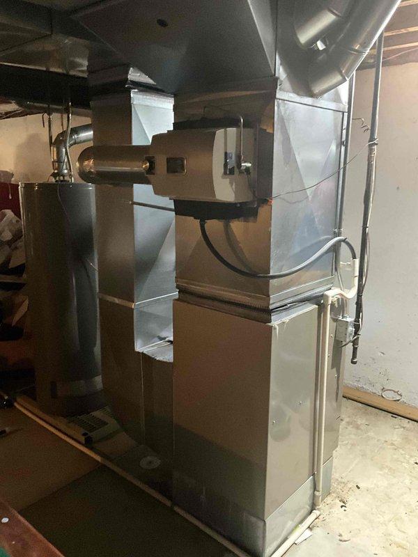 Conducted on-site evaluation for complete HVAC system replacement of 22-year-old furnace and air conditioning unit. Assessed existing equipment configuration including ductwork, refrigerant lines, condensate drainage system, and electrical connections in basement mechanical room. Provided comprehensive replacement quote for new heating and cooling system to customer who is comparing multiple estimates before proceeding with installation.