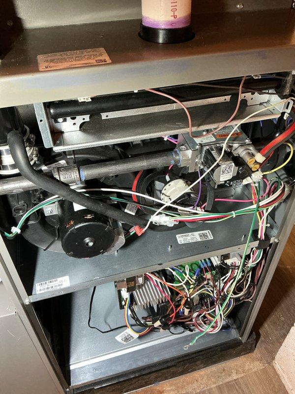 Completed scheduled AHC maintenance service on residential HVAC system. Accessed interior compartment, inspected blower motor assembly, electrical connections, and control components. Replaced air filters and evaporator pads as requested, verified all wire harnesses and capacitor connections secure, and confirmed proper system operation before closing access panel.