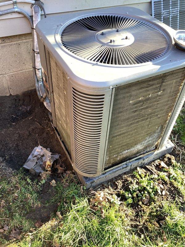 Completed annual cooling maintenance on residential air conditioning system. Upon inspection, found condenser unit with heavily soiled filter screen and accumulated dirt and debris covering front panel, significantly restricting airflow. Unit also showed signs of age with vegetation growth around base and algae discoloration on lower panels. Cleaned and serviced condenser unit, removing all debris and buildup from filter screens and exterior surfaces. Identified humidifier pad requiring replacement due to deterioration. Replaced humidifier pad to restore proper system operation and indoor air quality. Cleared vegetation and debris from around unit base to ensure adequate clearance and airflow. Verified all mechanical and electrical components operating within normal parameters following maintenance completion. System restored to optimal operating condition.
