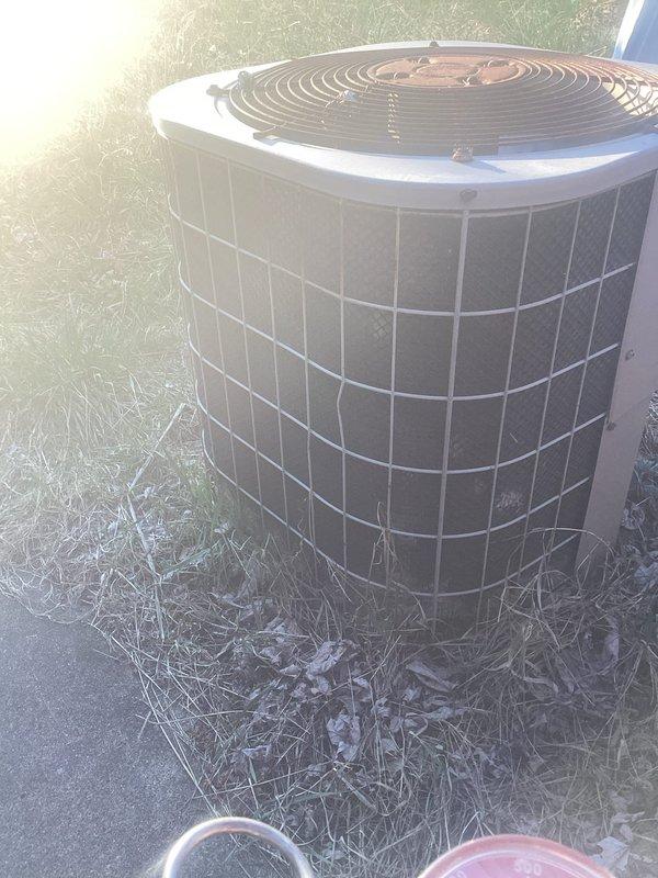 Responded to no-cooling complaint on residential air conditioning system. Upon arrival, found outdoor condensing unit producing buzzing sound with non-operational condenser fan motor. Inspected fan motor and capacitor assembly, identifying failed fan motor and weak dual run capacitor as root causes. Replaced defective condenser fan motor with OEM equivalent and installed new dual run capacitor to manufacturer specifications. Verified proper electrical connections, tested system operation, and confirmed condenser fan rotation and normal compressor function. Unit now cooling properly with no abnormal sounds. System returned to full operational status.