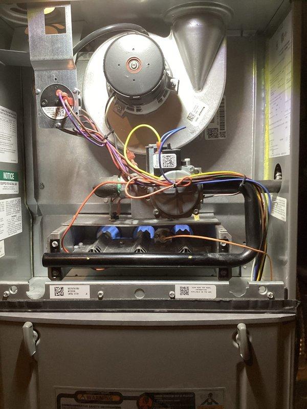 Responded to service call for furnace displaying code 12 (low flame sense) despite recent maintenance by another provider. Performed comprehensive tune-up and diagnostic inspection of gas furnace system. Inspected control board, flame sensor, burner assembly, and all electrical connections. Cleaned flame sensor rod to ensure proper microamp reading and verified burner ignition sequence with all three burners firing correctly. Checked blower motor operation, tested safety controls, and confirmed proper combustion. System operating normally with adequate heat output; cleared diagnostic code and monitored multiple heating cycles to verify reliable ignition and flame sensing. All components functioning within manufacturer specifications.