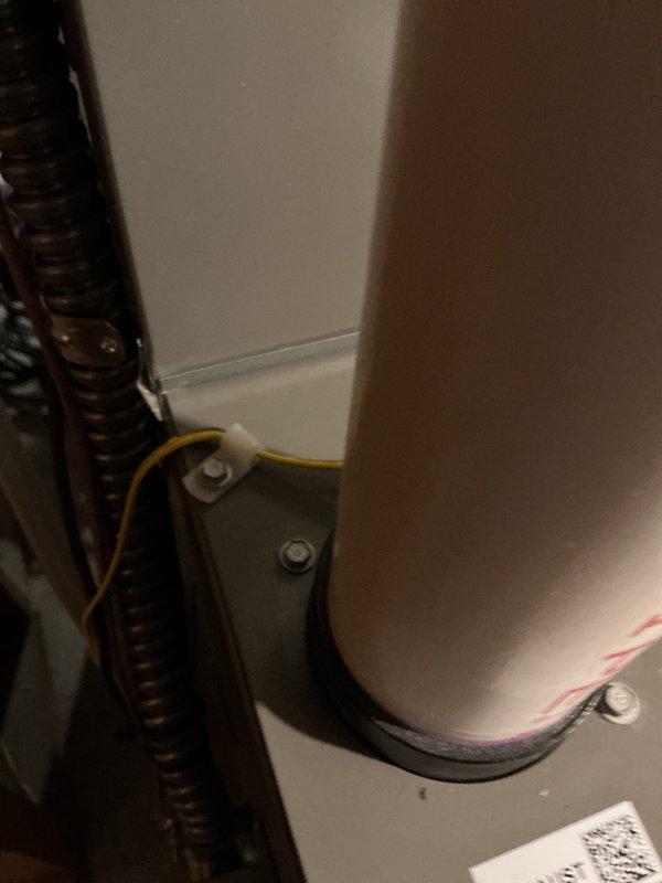 Returned to address violation repair identified during inspection of recently installed 70,000 BTU furnace and 2-ton air conditioning system with humidifier. Leveled outdoor condensing unit in rear yard to meet code requirements and ensure proper operation and drainage. Verified all mechanical and electrical connections, confirmed system operation, and documented corrective work with photos.