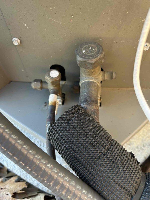 Responded to service call for air conditioning system not blowing cold air with attic-mounted air handler. Performed diagnostic inspection of system components, including examination of refrigerant valves and connections at the condensing unit. Verified proper operation of outdoor unit and checked refrigerant pressures. System restored to proper cooling operation and confirmed cold air delivery at registers.