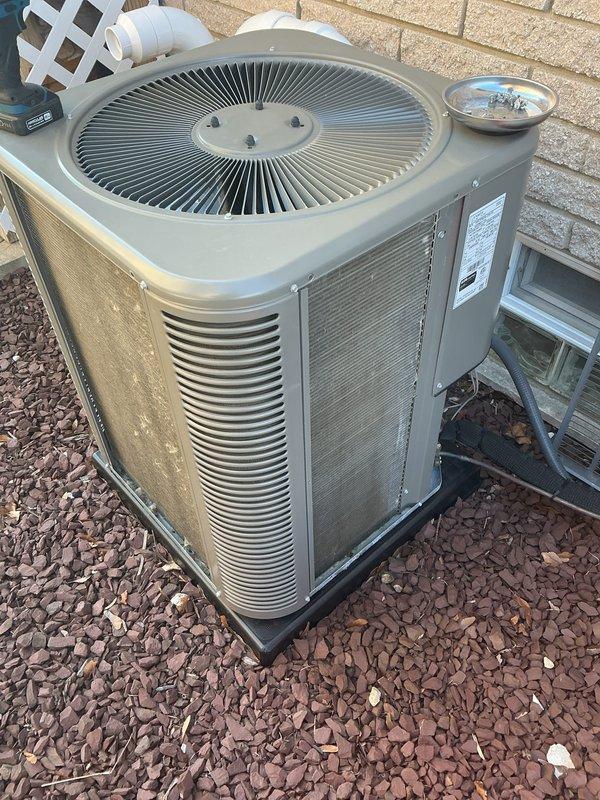 Completed annual preventive maintenance on residential split system air conditioning unit. Performed comprehensive inspection of outdoor condenser unit, verified proper operation of fan motor and compressor, cleaned condenser coils, checked refrigerant pressures, and confirmed electrical connections were secure. Unit operating within manufacturer specifications with no deficiencies noted at time of service.