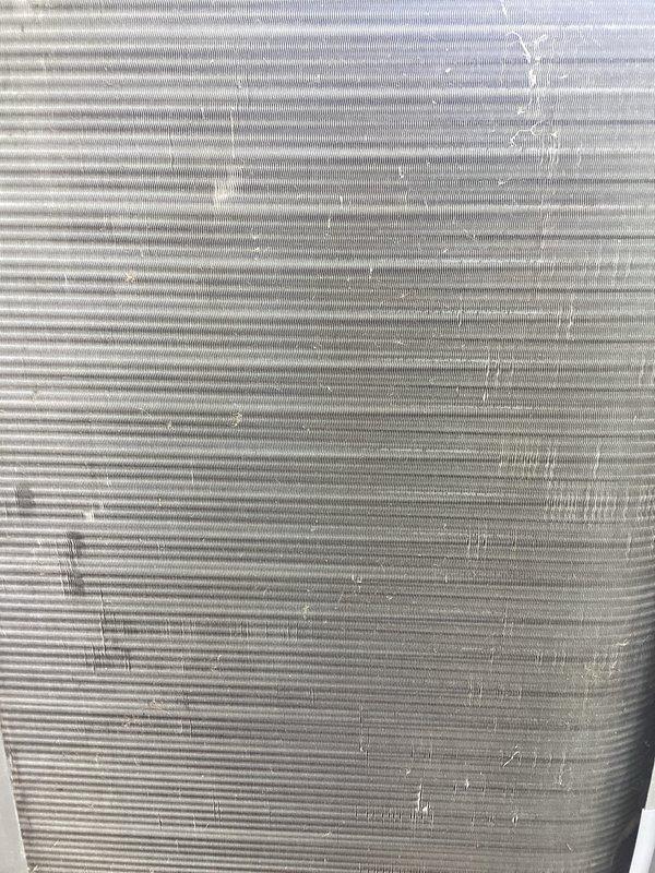 Completed annual cooling maintenance on residential air conditioning system. Inspected condenser coil and found moderate accumulation of dirt, dust, and organic debris on fins; cleaned coil surfaces to restore proper airflow and heat transfer efficiency. Verified all components operating within normal parameters upon completion of maintenance procedures.