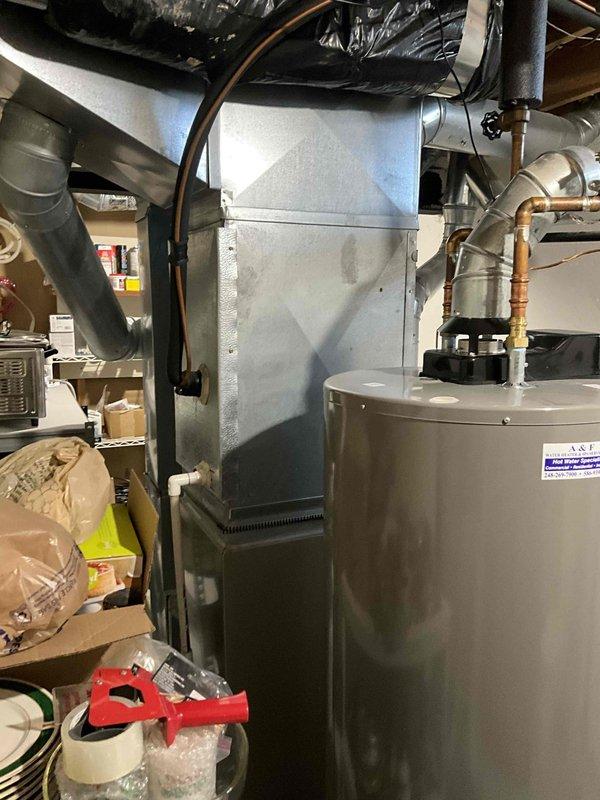 Conducted comprehensive on-site evaluation for full HVAC system replacement of existing 20-year-old furnace and air conditioning equipment. Performed visual inspection of current heating and cooling infrastructure, documented electrical service panel configuration and capacity, assessed existing ductwork connections and layout, and photographed mechanical equipment locations in basement utility area. Provided detailed replacement quote for new system installation based on current equipment specifications and home requirements.