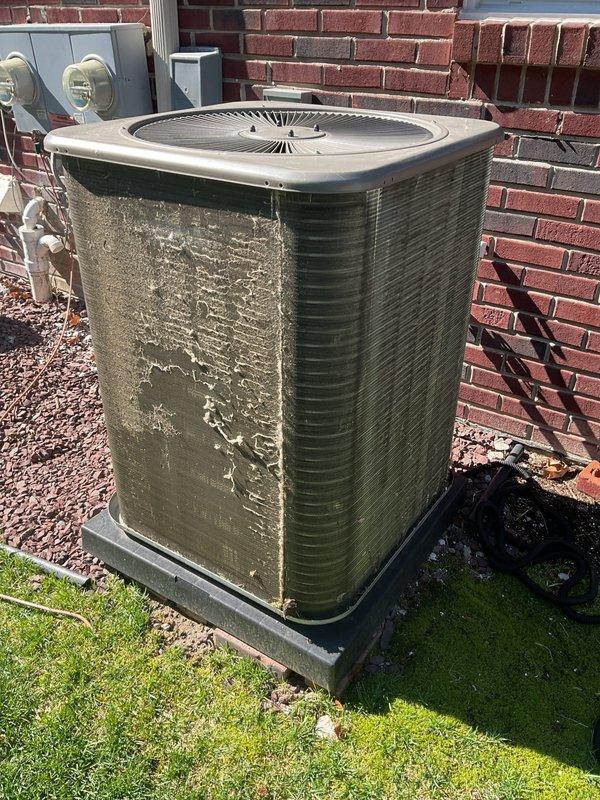 Completed annual cooling maintenance on residential air conditioning system. Performed comprehensive inspection of outdoor condensing unit, noting significant weathering and mineral deposits on exterior panels indicating potential water exposure or environmental degradation. Conducted standard maintenance procedures including system evaluation and documentation of unit condition. Customer advised that filters and evaporator pads may require replacement at next service interval.