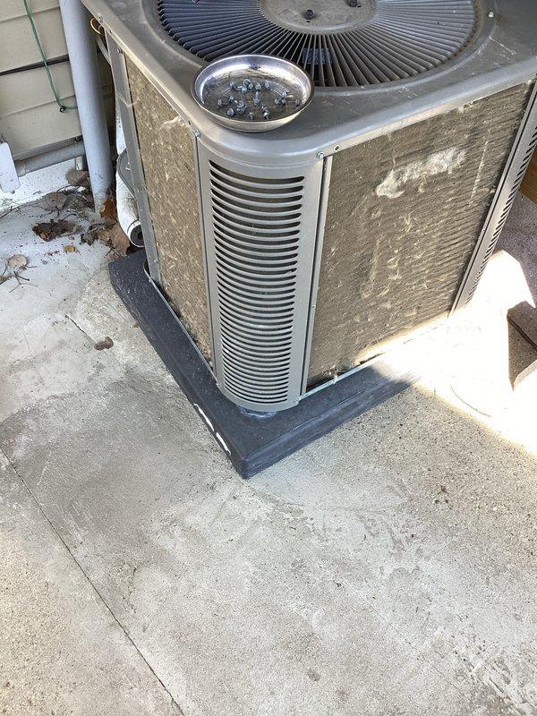 Completed annual cooling maintenance on outdoor condensing unit. Performed comprehensive system inspection including visual assessment of cabinet condition, fan operation, and refrigerant line connections. Unit showed normal weathering consistent with outdoor exposure but remains in functional condition. Condenser coils exhibited moderate dirt accumulation on exterior surfaces. Verified unit is properly mounted on isolation pad with adequate clearance for airflow. Documented equipment condition with photographs for service records. No filters required for this system configuration.