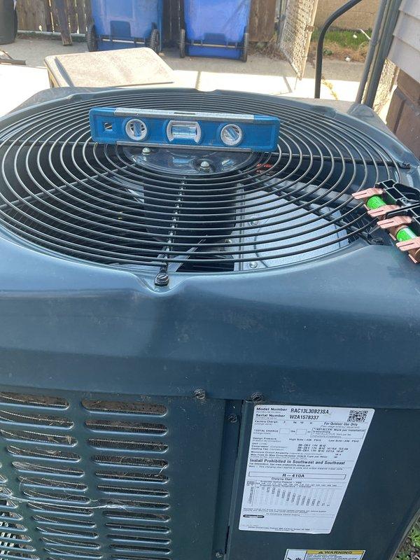 Completed annual cooling maintenance on residential air conditioning system. Performed comprehensive inspection of outdoor condenser unit, verified level installation of equipment, and documented unit condition with photographs. All components operating within normal parameters.