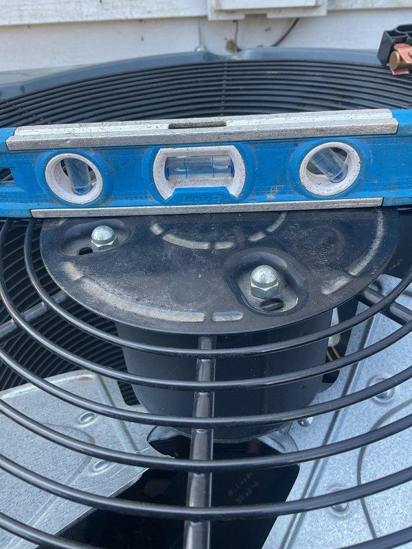 Completed annual cooling maintenance on residential air conditioning system. Performed comprehensive inspection of outdoor condenser unit, verified level installation of equipment, and documented unit condition with photographs. All components operating within normal parameters.