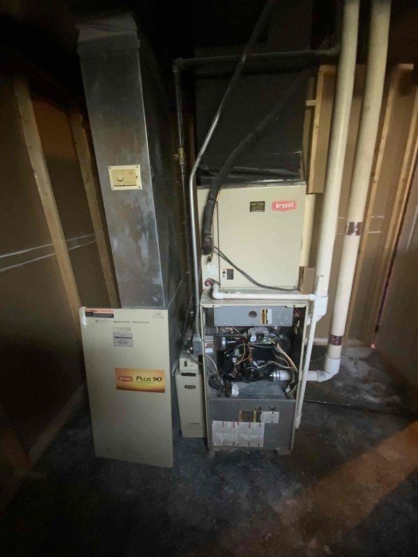 Conducted estimate for replacement of non-operational natural gas furnace and air conditioning system located in basement. Existing equipment estimated at 20+ years old, including a Plus 90 high-efficiency furnace with exposed blower assembly and associated air handler components. Assessed ductwork configuration, condensate drainage system, and existing infrastructure to provide comprehensive replacement proposal for complete HVAC system upgrade.