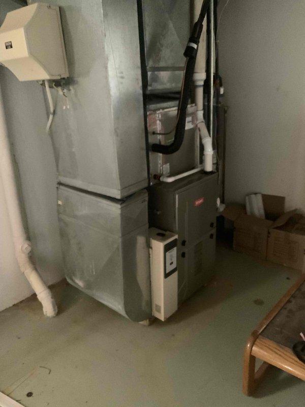 Conducted estimate for replacement of non-operational natural gas furnace and air conditioning system located in basement. Existing equipment estimated at 20+ years old, including a Plus 90 high-efficiency furnace with exposed blower assembly and associated air handler components. Assessed ductwork configuration, condensate drainage system, and existing infrastructure to provide comprehensive replacement proposal for complete HVAC system upgrade.