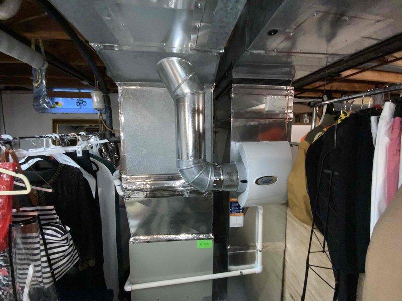 Provided comprehensive estimate for replacement of 15-year-old furnace and air conditioning system located in basement mechanical room. Current equipment is operational but nearing end of service life, prompting evaluation for updated HVAC system to improve efficiency and reliability. Assessment included documentation of existing installation configuration, ductwork connections, available clearances in utility space, and coordination requirements with adjacent water heater and plumbing infrastructure.