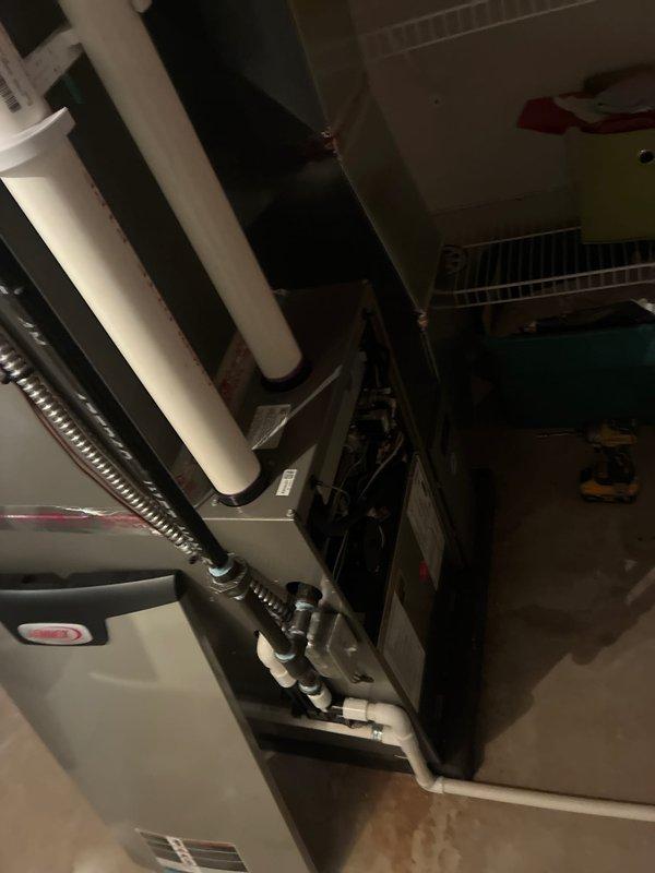 Completed routine maintenance on residential HVAC system including both heating and cooling components. Inspected air handler unit, furnace cabinet, and associated ductwork in basement mechanical room. Verified proper operation of condensate drain lines and PVC piping connections, checked flexible conduit and electrical connections, and examined all accessible components for wear or potential issues. System is operating within normal parameters and ready for continued service.