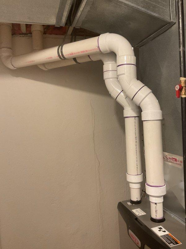 Completed installation of 90,000 BTU furnace system in residential basement. Installed new PVC venting system with proper termination and drainage configuration, ensuring code-compliant exhaust and intake air routing. Connected gas supply line with appropriate shutoff valve and pressure testing. Established electrical connections and verified proper voltage and amperage for unit operation. Secured all necessary mechanical and electrical permits prior to installation. Tested system startup sequence, verified ignition operation, and confirmed proper airflow through existing ductwork. All components functioning within manufacturer specifications upon completion.