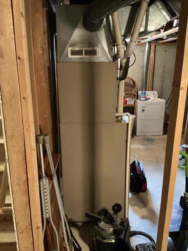 Provided estimate for replacement of 25-year-old furnace and air conditioning system located in basement. Current natural gas furnace and AC unit are operational but have reached end of expected service life. Evaluated existing electrical panel, ductwork connections, and mechanical room layout to determine equipment specifications and installation requirements for new HVAC system.