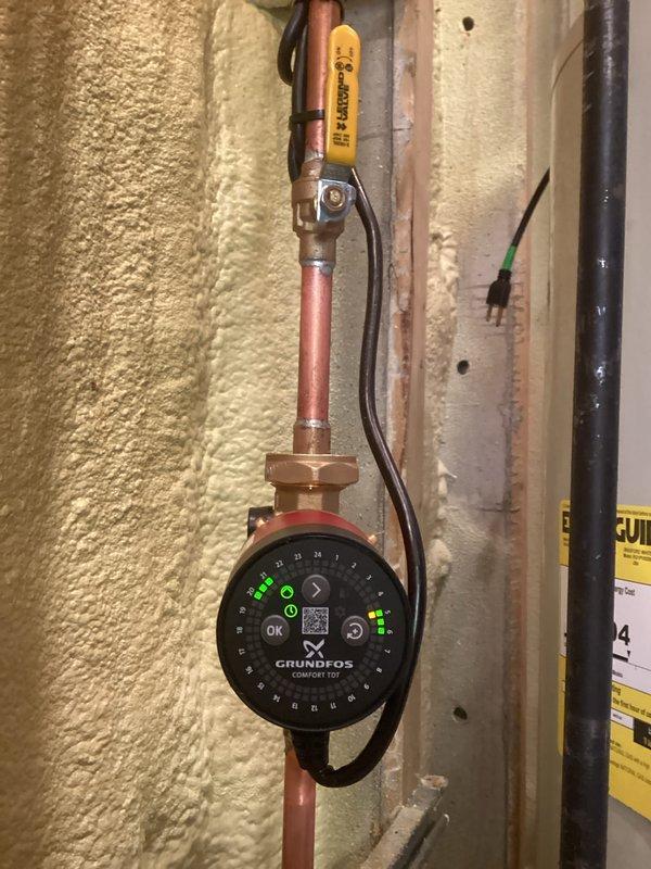 Installed a new 50-gallon Bradford White tanked water heater with complete plumbing connections including copper supply and discharge piping. Installation included a Grundfos Comfort TGT recirculation pump with digital controls and status indicators, ball valves for system isolation, pressure relief valve, and proper electrical connections. All mechanical permits were obtained prior to installation, and the system was tested and verified operational upon completion.