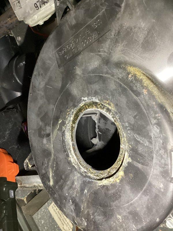 Responded to service call for furnace producing abnormal noise from blower assembly while maintaining heating operation. Upon inspection, found significant accumulation of dust and debris on blower wheel and housing, particularly around the squirrel cage fan assembly. Excessive buildup was causing operational noise and restricting airflow. Inspected Fasco blower motor for proper operation and mechanical integrity. Documented conditions with photographs showing debris accumulation on blower wheel interior and motor assembly. Coordinated access with tenant-occupied property for diagnostic evaluation.