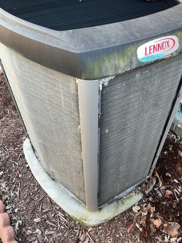 # HVAC Maintenance - ACM Completed

Performed annual cooling maintenance on Lennox outdoor condensing unit per service agreement. Conducted comprehensive system diagnostics using Fieldpiece SMAN refrigeration manifold with micron gauge capability. Measured and recorded refrigerant pressures and temperatures across the system, verifying proper operating parameters. Low side pressure reading of 94.2 PSI and high side pressure reading of 191.2 PSI indicated normal system operation. Superheat measured at 33.8°F and subcooling at 51.7°F, both within manufacturer specifications for ambient conditions.

Inspected exterior cabinet and noted biological growth (algae/mold) accumulation on top panel and upper corners of unit. Observed varying degrees of panel weathering and discoloration from environmental exposure. Unit positioned on concrete pad with adequate clearance, though surrounded by mulch and organic debris. Verified all electrical connections secure and operational. System operating ef