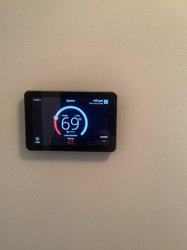 Responded to service call for Lennox iComfort thermostat displaying communication error with HVAC equipment. Upon arrival, confirmed thermostat was unable to establish connection with Smart Hub and heating system located in basement. Troubleshot communication failure between wall-mounted iComfort control panel and equipment, verified thermostat was powered and displaying proper temperature readings of 69°F with heat setpoint at 67°F. Diagnosed connectivity issue between thermostat and Smart Hub device, restored communication protocol, and verified system operation. Confirmed heating system responding properly to thermostat commands and all functions operating as designed. System tested and left in working order with both parts and labor under warranty coverage.