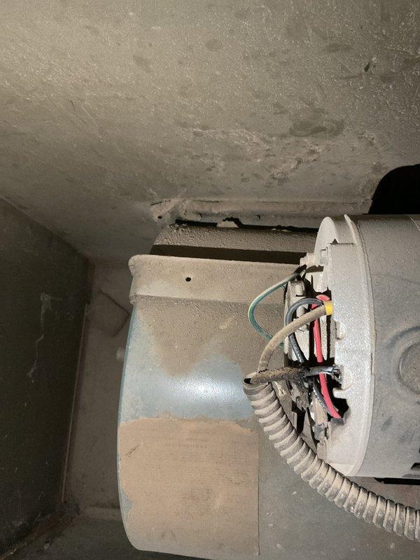 Responded to no heat call on residential furnace system. Upon arrival, homeowner reported unit alternating between hot and cold air output and requiring thermostat to be set significantly higher than normal to maintain adequate heating. Conducted visual inspection of furnace and surrounding utility area, noting aged equipment and deteriorated conditions in mechanical room with visible ceiling damage and worn surfaces.

Performed system diagnostics and discovered severely restricted airflow due to heavily soiled air filter. Removed 20x25x1 HDX filter which exhibited extensive dust and particulate accumulation throughout pleated media, causing reduced system efficiency and improper cycling. Dirty filter was restricting airflow to heat exchanger, resulting in temperature fluctuations and inadequate heat distribution. This restriction forced system to run extended cycles and prevented proper heat transfer, explaining why thermostat required higher settings to achieve desired temperatures.

