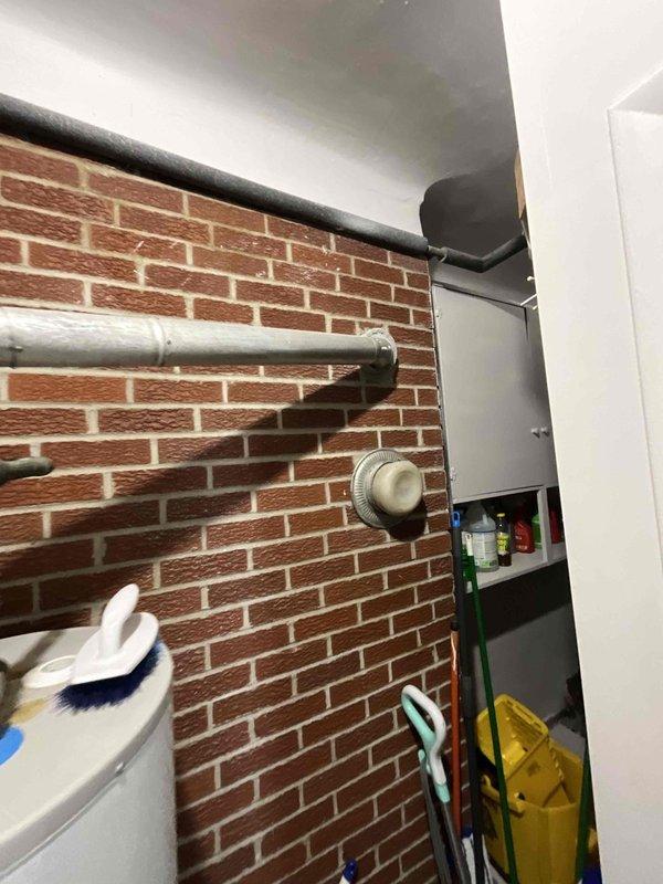 Completed estimate for furnace replacement on aging residential heating system over 20 years old located in basement utility area. Assessed existing furnace unit with beige metal cabinet, associated ductwork, and PVC venting system. Documented current equipment configuration including air handler placement and mechanical room layout for replacement proposal.