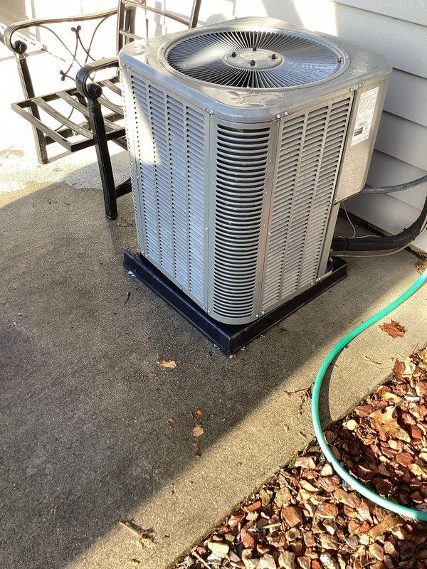 Completed annual furnace maintenance tune-up as part of membership program on a brand new furnace system (0 years old). Performed comprehensive inspection and servicing of the heating unit, ensuring all components were operating within manufacturer specifications. During the service visit, also inspected the outdoor air conditioning condenser unit positioned on the rooftop, which showed normal operating condition with proper clearances and ventilation. Verified capacitor functionality (40/5 MFD dual capacitor observed during inspection), checked electrical connections, and confirmed the condensing unit was properly secured on its pad. Cleaned debris including leaves from around both the rooftop condenser unit and ground-level equipment areas to ensure proper airflow and system efficiency. All safety controls tested and verified operational on both heating and cooling systems.