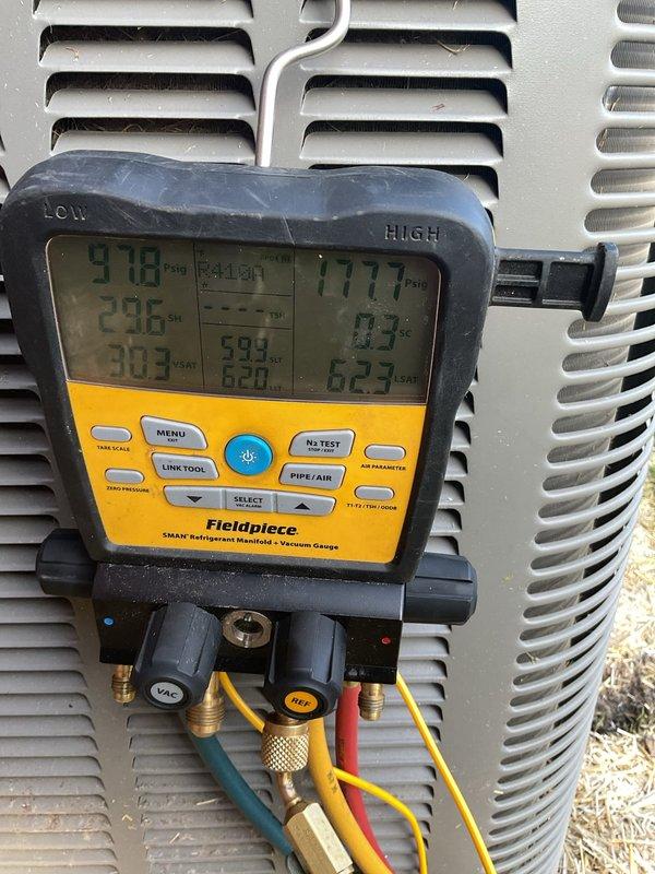 Completed routine air conditioning maintenance on residential split system unit. Performed system diagnostics using refrigerant manifold gauges, measuring operating pressures on both high and low sides to verify proper refrigerant charge and system performance. All readings were within manufacturer specifications, indicating optimal system operation. No refrigerant adjustment or additional service required at this time.