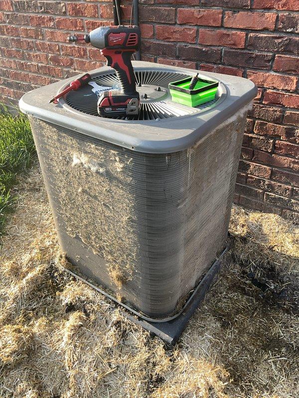 Completed routine air conditioning maintenance on residential split system unit. Performed system diagnostics using refrigerant manifold gauges, measuring operating pressures on both high and low sides to verify proper refrigerant charge and system performance. All readings were within manufacturer specifications, indicating optimal system operation. No refrigerant adjustment or additional service required at this time.